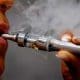/ Electronic cigarettes are displayed in a Paris store, Tuesday, Oct. 8, 2013.